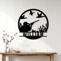 Duck hunting wall decor displayed on a light paneled wall above a rustic console table