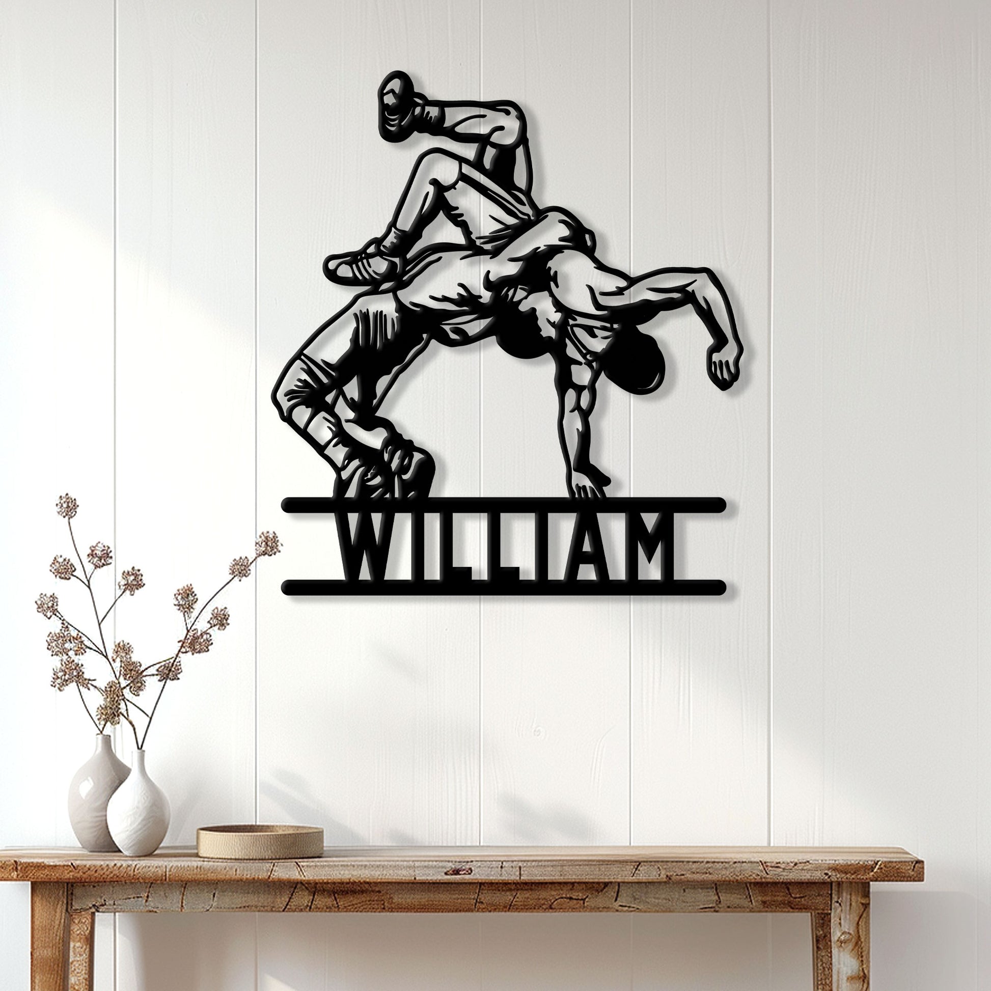 Wrestling wall decor displayed on a paneled wall above a console table