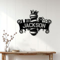 Black barber metal sign displayed on a light wood wall above a console table in a modern interior