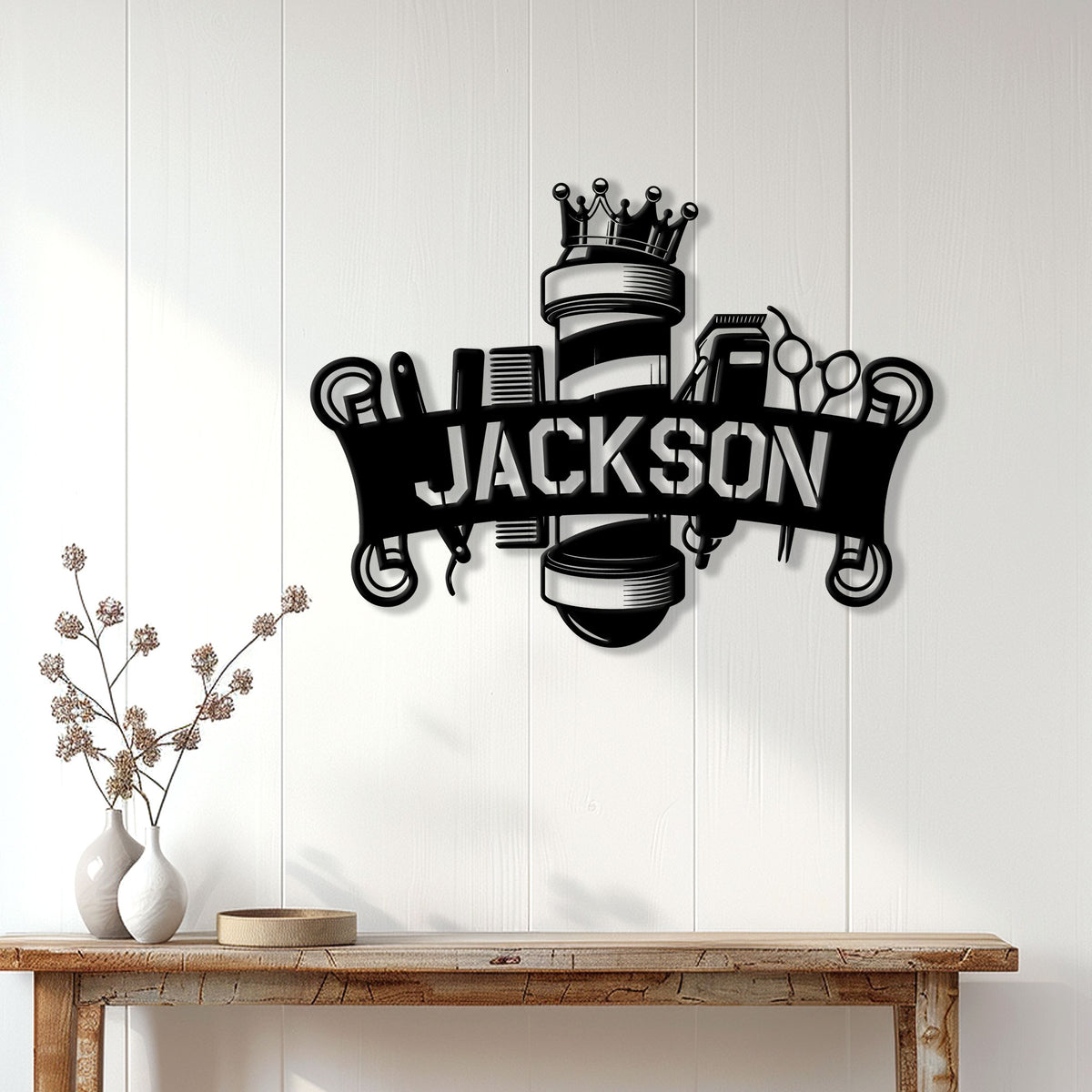 Black barber metal sign displayed on a light wood wall above a console table in a modern interior