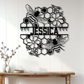 Honeybee and flower wall sign displayed on white wood paneling in a bright home setting