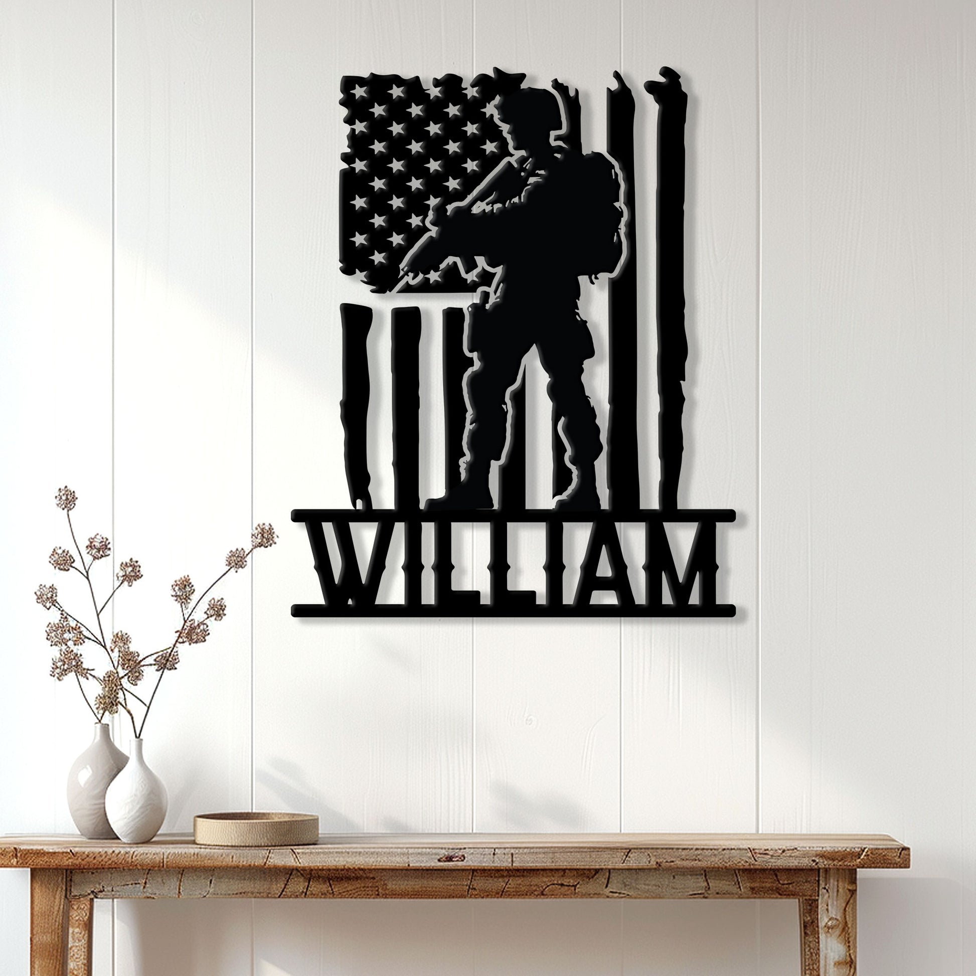 Patriotic veteran wall decor displayed on a light wood-paneled wall above a console table