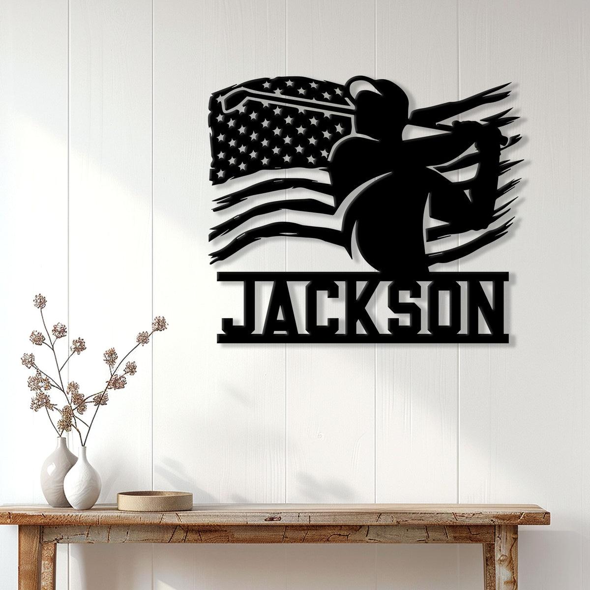 Golfer silhouette metal wall sign displayed on a bright home wall above a console table