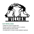 Wrestling cut metal sign showing two grapplers in a bold black silhouette design