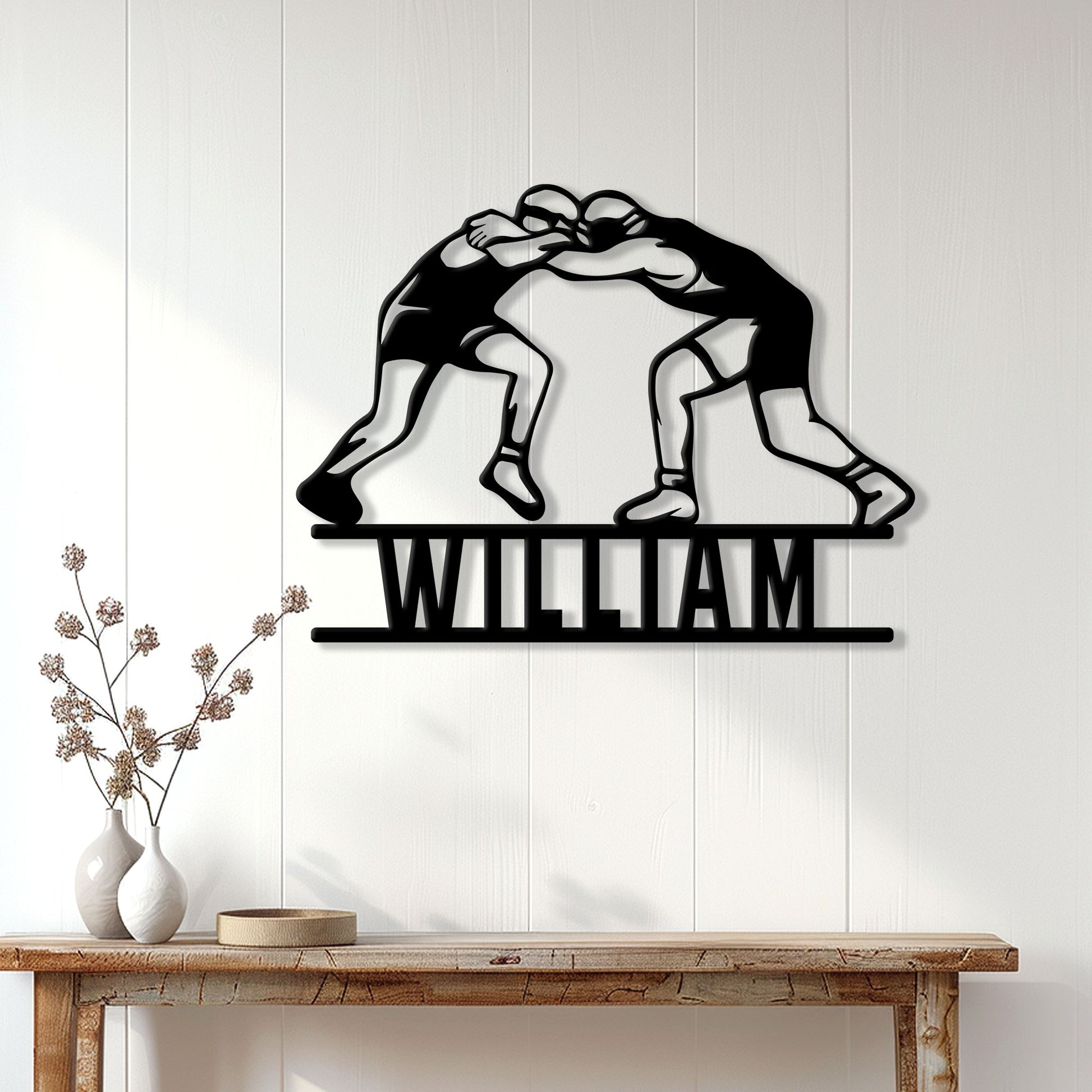 Wrestling wall decor displayed above a console table in a bright modern home