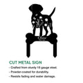 Cut metal Labrador Retriever memorial sign featuring flowers, butterflies, and a bone-shaped base