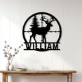 Antlered deer metal wall sign displayed on a light wood-paneled wall in a rustic home setting