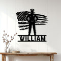 Black police officer metal wall sign displayed on a bright paneled wall in a home decor setting