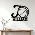 Black basketball metal wall sign displayed above a console table in a bright modern home