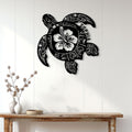 Black sea turtle wall sign displayed above a console table in a bright, modern coastal-style room