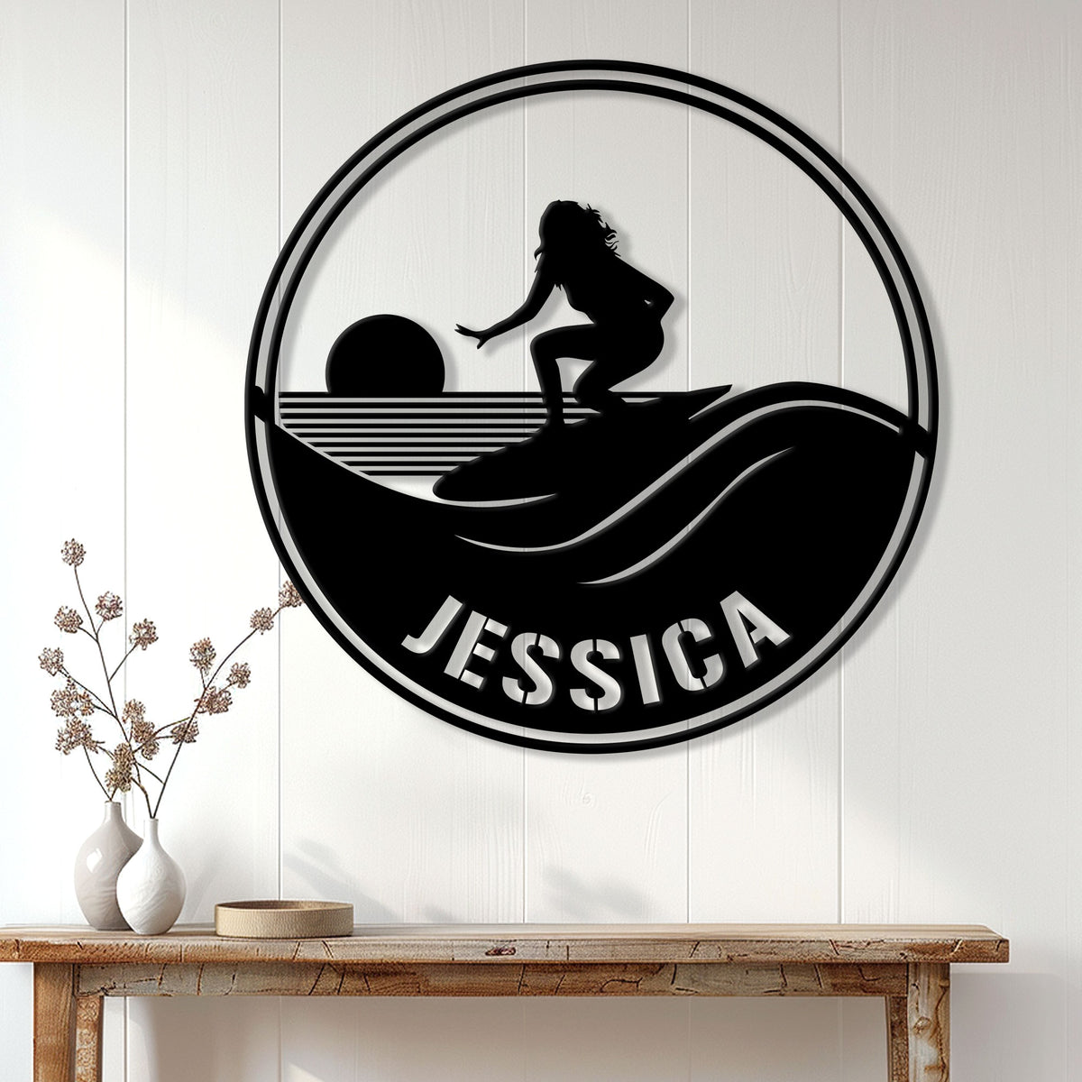 Round surfer wall sign displayed above a console table in a bright coastal-style room