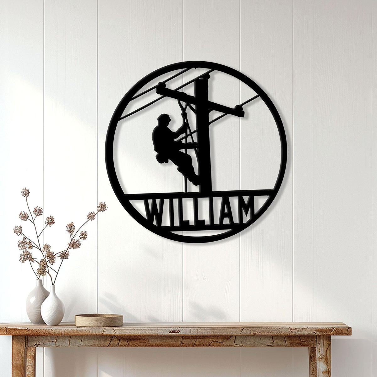 Lineman wall sign displayed on a white paneled wall above a rustic console table