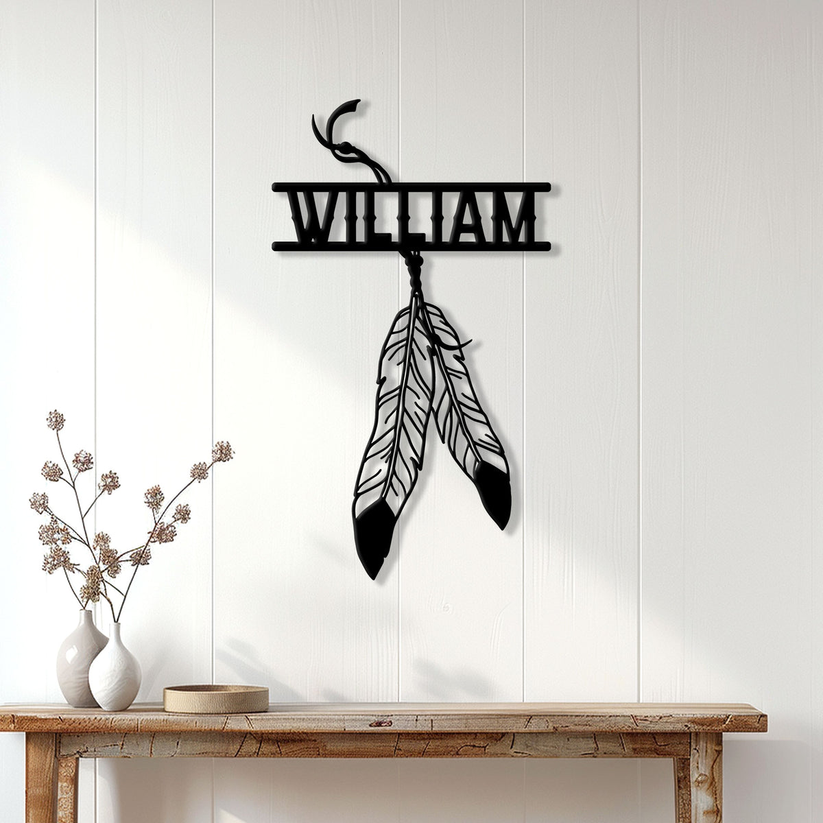 Native American feather dreamcatcher metal sign displayed on a light wood-paneled wall above a console table
