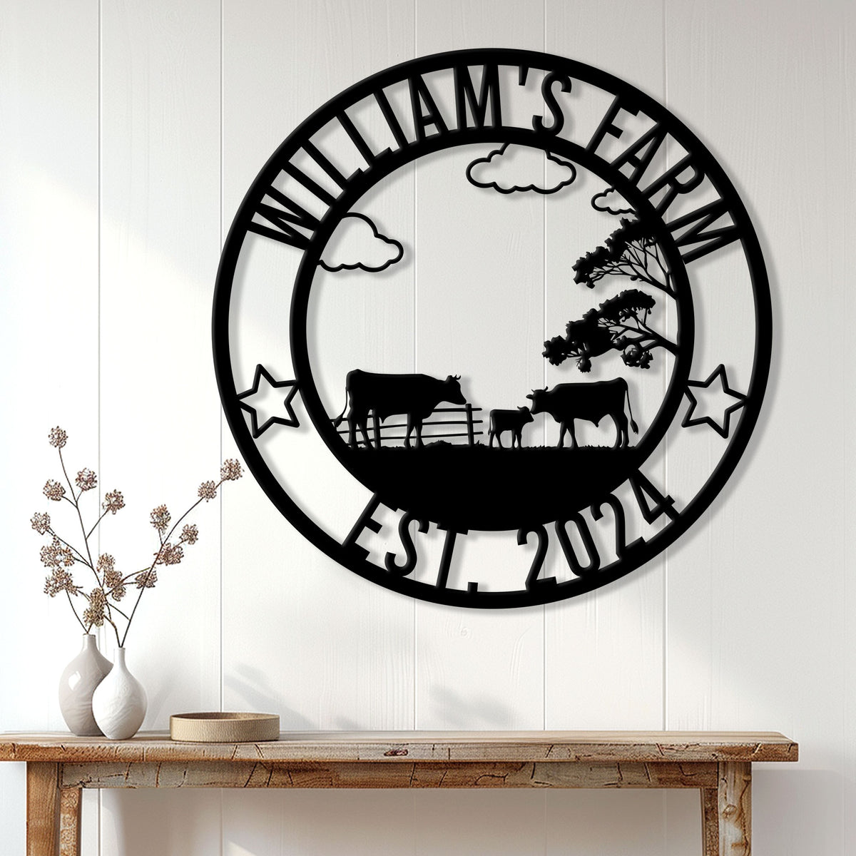 Cow farm metal wall sign displayed above a rustic console table in a bright farmhouse interior