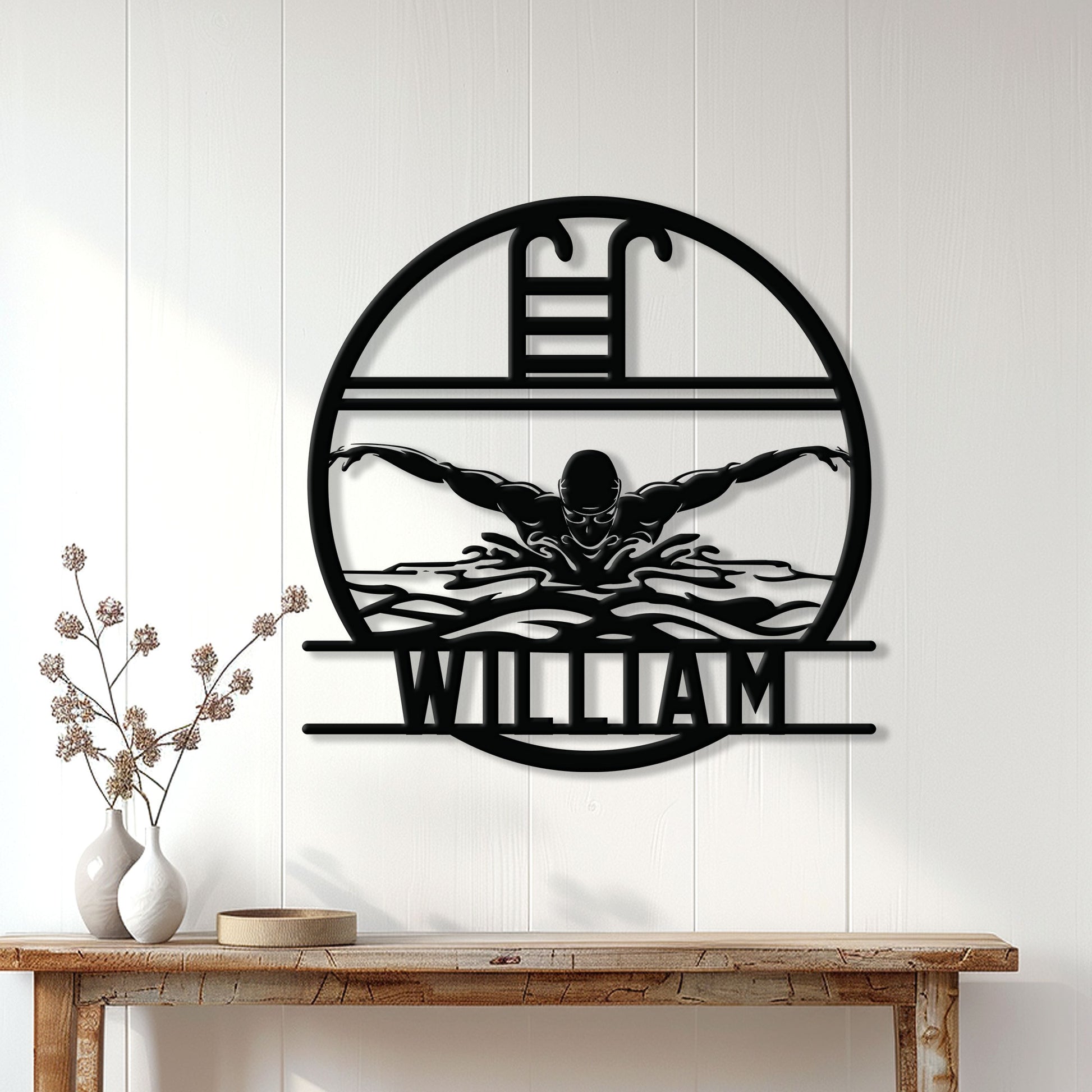 Black swimming metal sign displayed on a white paneled wall above a console table