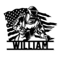 Patriotic welder metal sign featuring a masked worker, welding sparks, and a flowing American flag backdrop