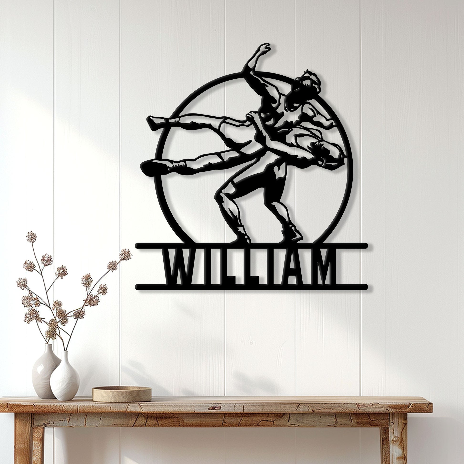 Wrestling wall decor displayed on a bright paneled wall above a console table