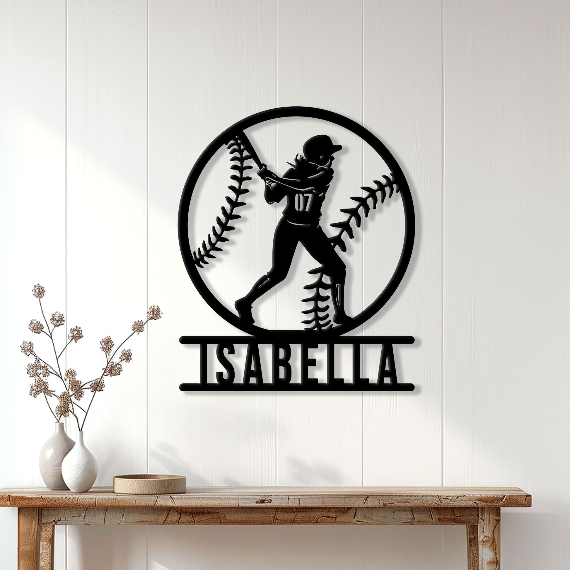 Softball wall sign displayed on a bright paneled wall above a console table