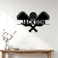 Pickleball wall sign displayed on a white paneled wall above a wood console table