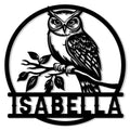 Detailed black owl metal sign perched on a leafy branch inside a circular frame