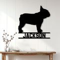 French Bulldog metal wall sign displayed on a light paneled wall above a console table