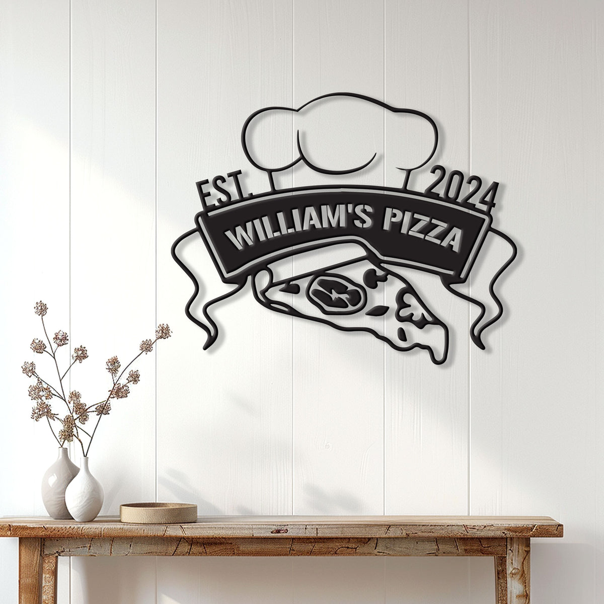 Pizza metal wall sign displayed above a console table on a bright white paneled wall