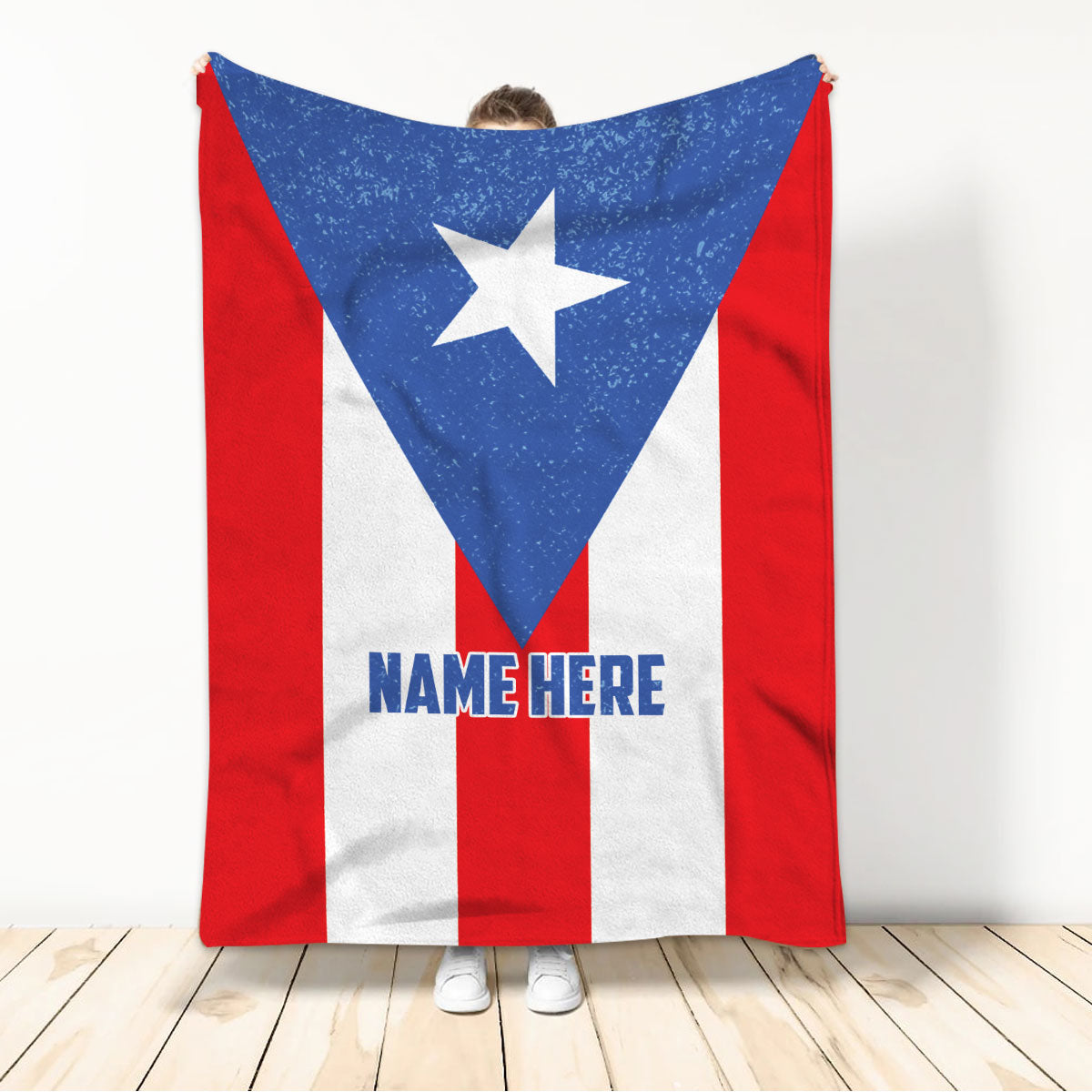 Puerto Rican flag throw blanket displayed by a person against a bright indoor backdrop