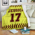 Yellow and burgundy softball blanket draped over a sofa with athletic jersey-style design