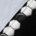 Close-up view of soft blanket texture with black and white soccer ball pattern