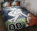 Football quilt blanket styled on a bed with player artwork, football graphics, and bold blue, green, and red colors