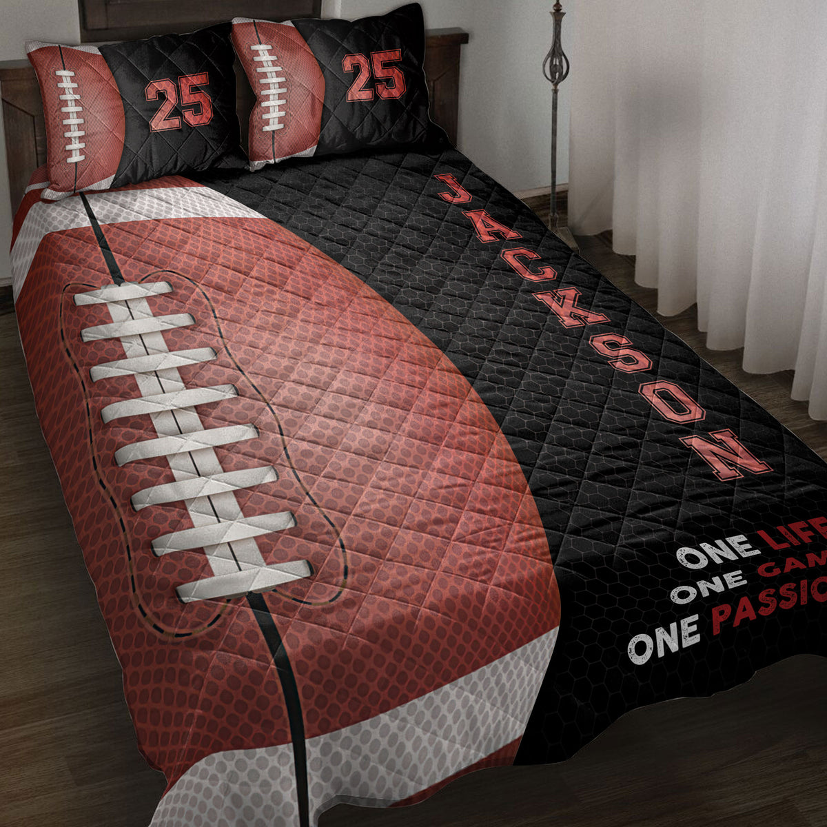 American football quilt blanket displayed on a bed with red and black football artwork