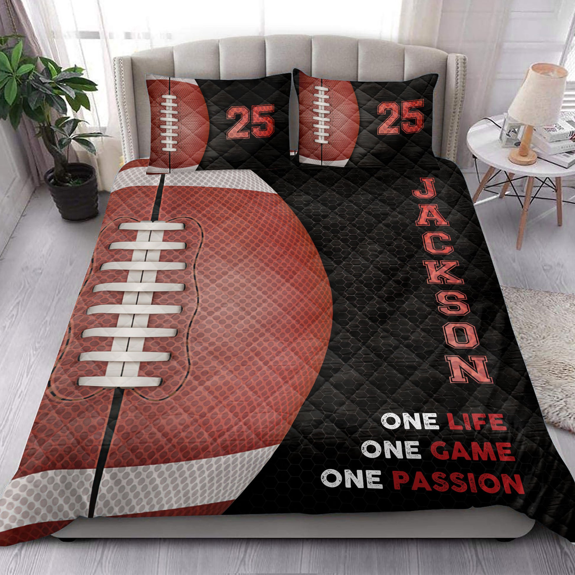 American football quilt blanket styled across a modern bedroom with bold red and black graphics