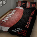 Close view of football quilt bedding with detailed ball texture, laces, and bold sports artwork