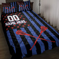 Lacrosse quilt blanket on a bed with crossed sticks, red stars, blue stripes, and bold sports artwork