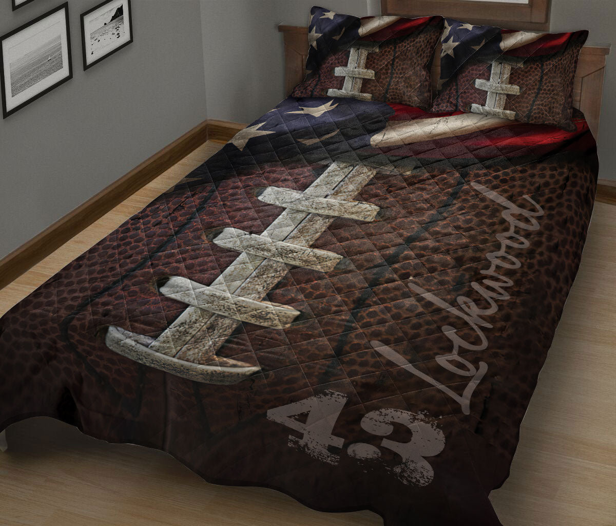 Patriotic football quilt blanket spread across a bed with stars, red and blue accents, and bold sports artwork