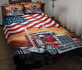 Red semi truck quilt blanket displayed on a bed with American flag artwork and patriotic colors