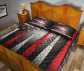 Patriotic baseball quilt blanket styled on a bedroom bed with red and white bat graphics