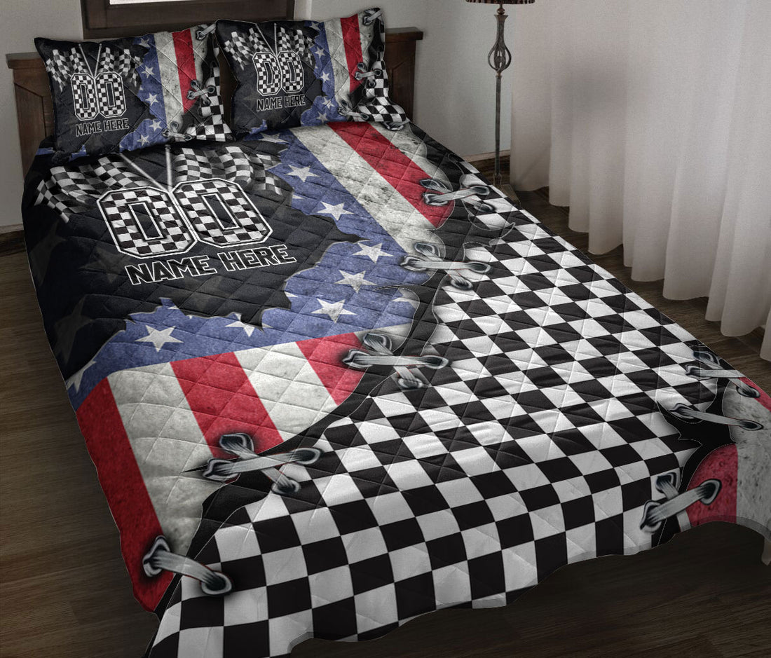 Racing quilt blanket displayed on a bed with checkered flags, red white blue graphics, and bold motorsport artwork