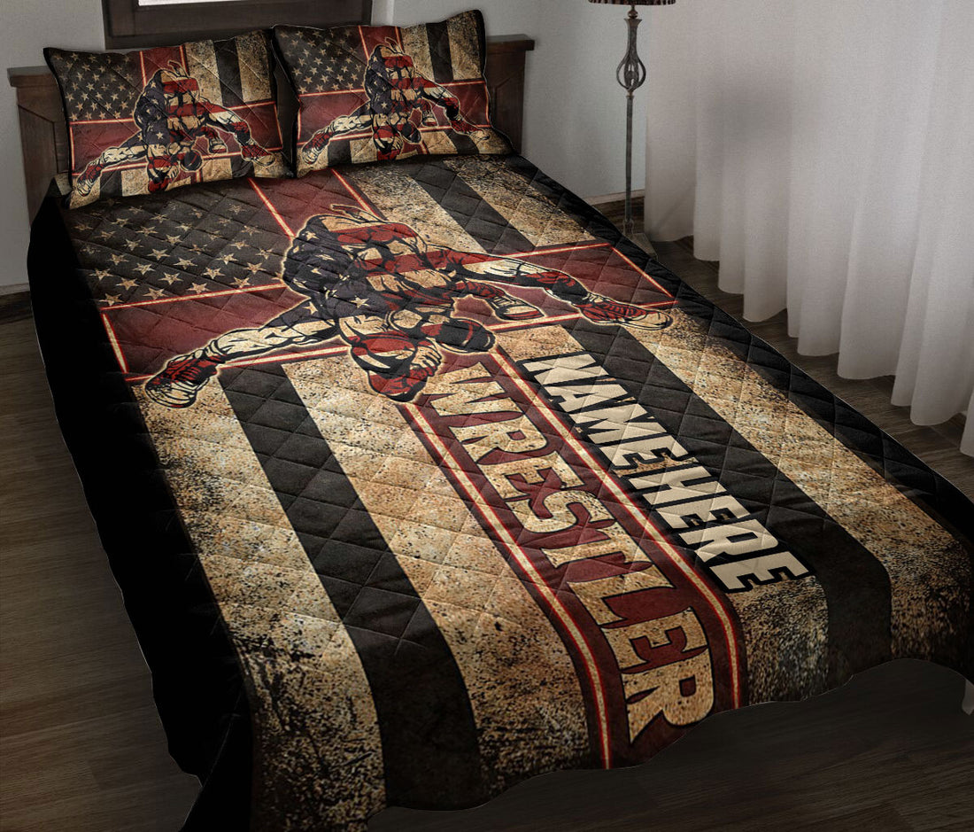 Wrestling quilt blanket styled on a bed with patriotic flag graphics and vintage red, black, and tan artwork