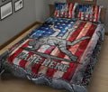 Close bedroom view of a wrestling quilt blanket with dramatic red, white, and blue artwork