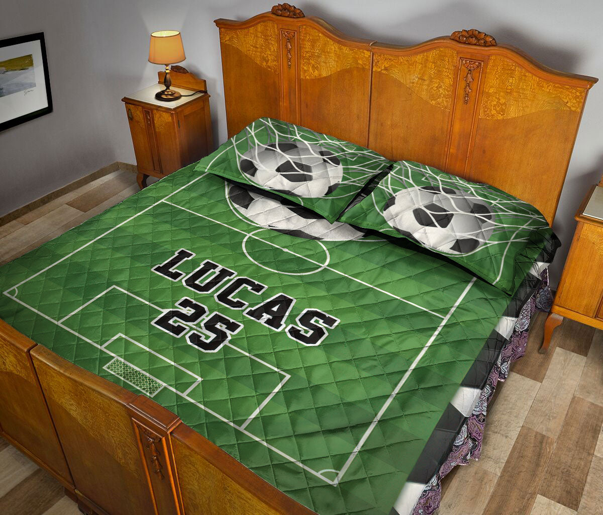 Soccer-themed quilt blanket styled across a bedroom with green field graphics and soccer ball artwork
