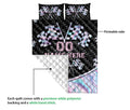 Racing quilt showing checkered flag artwork, a printed front, and a white quilted backing