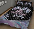 Motorsport quilt blanket on a bed featuring repeated checkered flags and a black geometric racing design