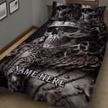 Dark skull and skeleton quilt blanket arranged on a bed for gothic bedroom decor