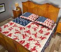 Motocross quilt blanket styled in a bedroom with red dirt bike rider silhouettes and blue star accents