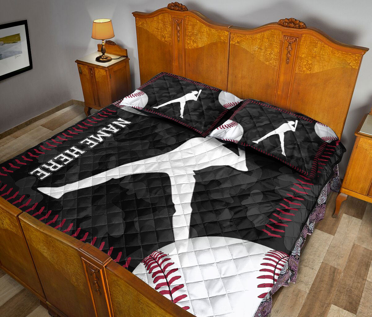 Baseball quilt blanket styled across a bedroom with bold batter silhouettes and black, white, and red artwork