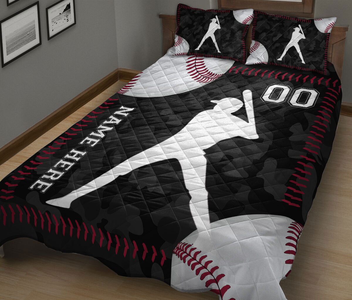 Baseball quilt blanket on a bed featuring oversized baseballs, batter silhouettes, and red stitching details