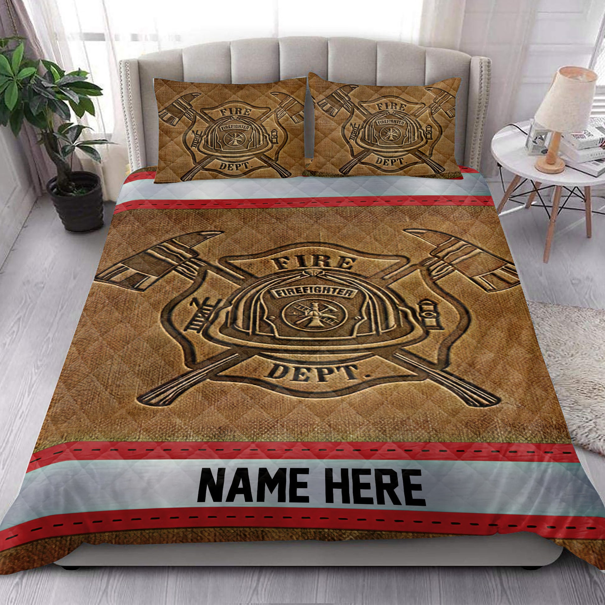 Firefighter quilt blanket styled in a bedroom with fire department emblem artwork and red trim