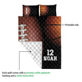 American football quilt blanket detail showing the printed side and white quilted backing