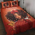 Bedroom scene featuring a red quilt blanket with Black girl portrait artwork and butterfly accents